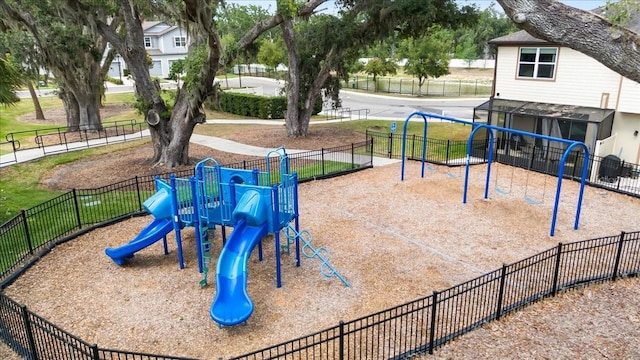 communal playground featuring fence
