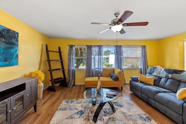 1453 62nd Ter S, Saint Petersburg, FL 33705 - living area with healthy amount of natural light, light wood-style flooring, and ceiling fan