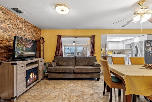 1453 62nd Ter S, Saint Petersburg, FL 33705 - living room featuring a ceiling fan
