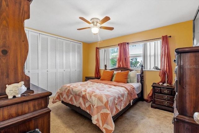 1453 62nd Ter S, Saint Petersburg, FL 33705 - bedroom with light carpet, a closet, and ceiling fan