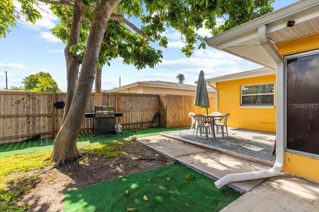 1453 62nd Ter S, Saint Petersburg, FL 33705 - view of yard with a patio and outdoor dining area