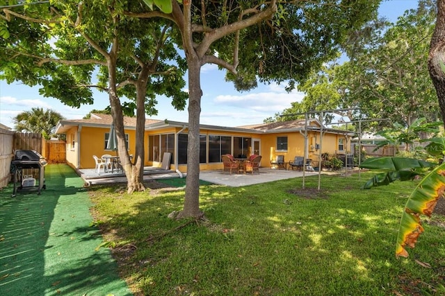 1453 62nd Ter S, Saint Petersburg, FL 33705 - back of property featuring stucco siding and a patio