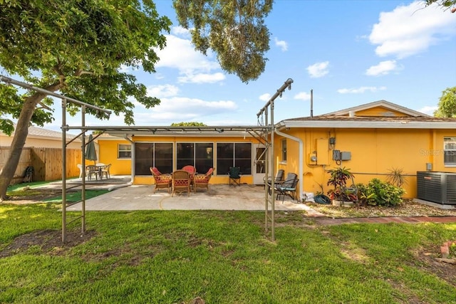 1453 62nd Ter S, Saint Petersburg, FL 33705 - back of house with central AC, a patio area, and stucco siding