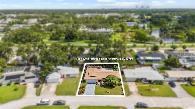 1453 62nd Ter S, Saint Petersburg, FL 33705 - aerial view of residential area with property boundaries highlighted and a nearby body of water