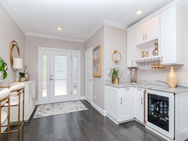 2807 W Hawthorne Rd Unit 11, Tampa, FL 33611 - foyer with wine cooler, dark wood-style floors, a dry bar, ornamental molding, and recessed lighting