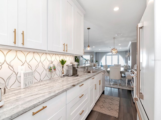 2807 W Hawthorne Rd Unit 11, Tampa, FL 33611 - kitchen featuring a sink, open floor plan, white cabinetry, recessed lighting, and dark wood finished floors