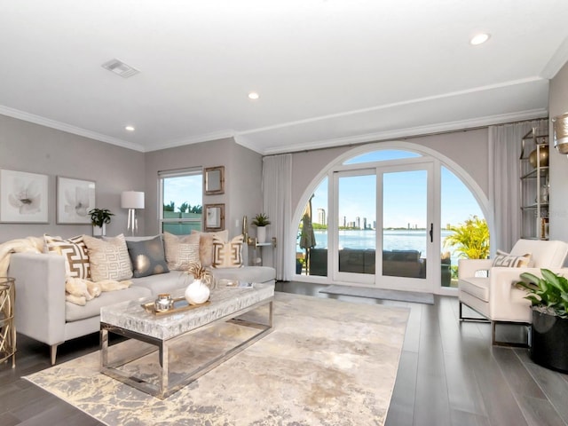 2807 W Hawthorne Rd Unit 11, Tampa, FL 33611 - living room featuring ornamental molding, wood finished floors, recessed lighting, and a water view