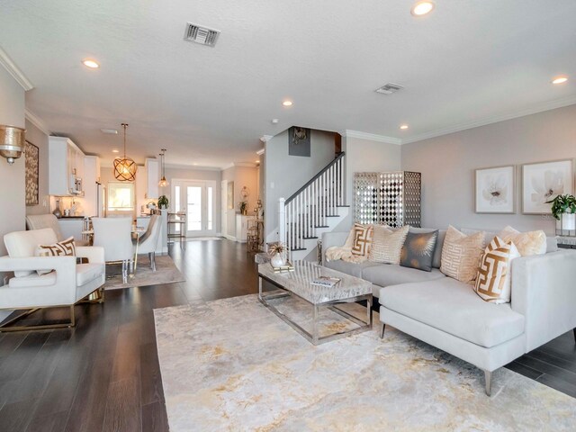 2807 W Hawthorne Rd Unit 11, Tampa, FL 33611 - living area with crown molding, wood finished floors, recessed lighting, and stairs