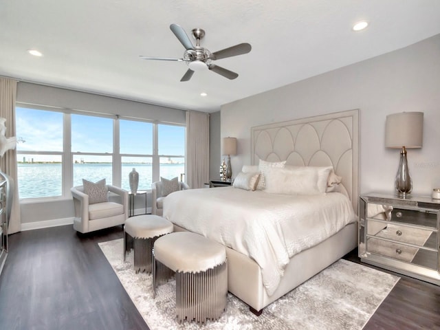 2807 W Hawthorne Rd Unit 11, Tampa, FL 33611 - bedroom featuring a water view, wood finished floors, recessed lighting, a ceiling fan, and baseboards