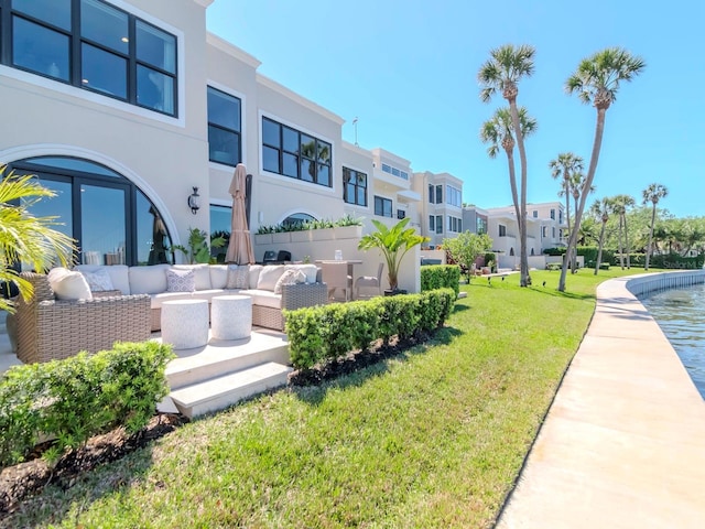 2807 W Hawthorne Rd Unit 11, Tampa, FL 33611 - view of home's community featuring an outdoor hangout area, a lawn, and a residential view