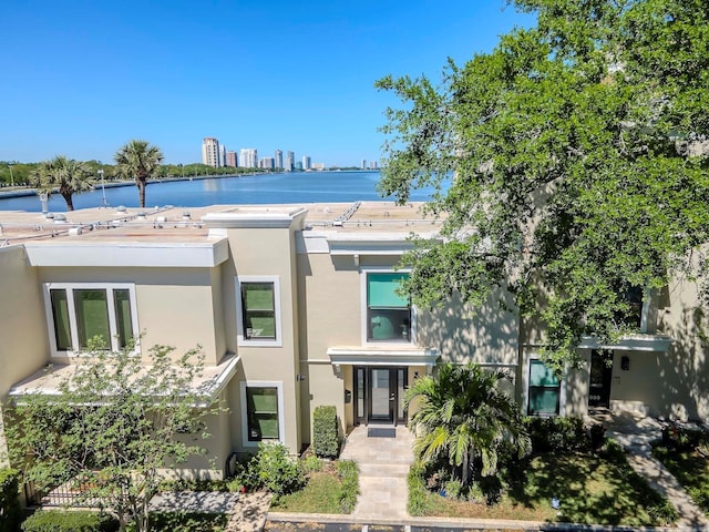 2807 W Hawthorne Rd Unit 11, Tampa, FL 33611 - view of front of property featuring stucco siding and a water view