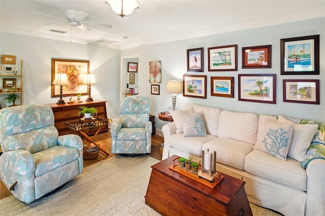 living area featuring crown molding, wood finished floors, and ceiling fan