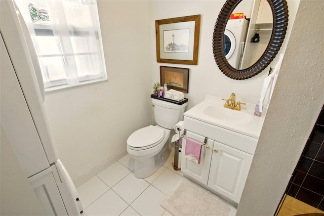 bathroom featuring tile patterned flooring, toilet, and vanity