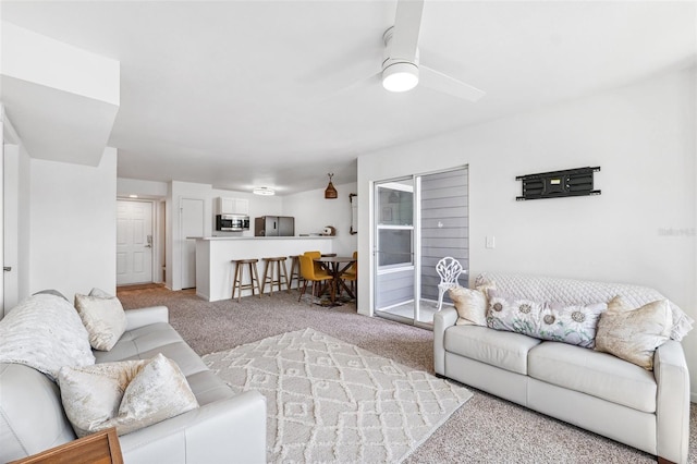 5712 Biscayne Ct Unit 103, New Port Richey, FL 34652 - living area with light colored carpet and ceiling fan