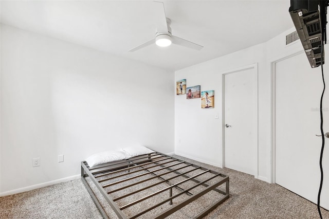 5712 Biscayne Ct Unit 103, New Port Richey, FL 34652 - bedroom featuring carpet floors, ceiling fan, and baseboards