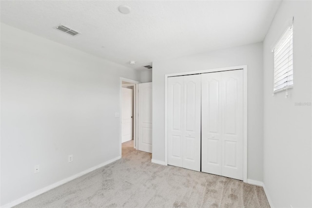 1119 Ballard Green Pl, Brandon, FL 33511 - unfurnished bedroom featuring carpet floors, baseboards, and a closet
