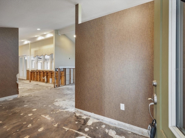 foyer entrance featuring baseboards