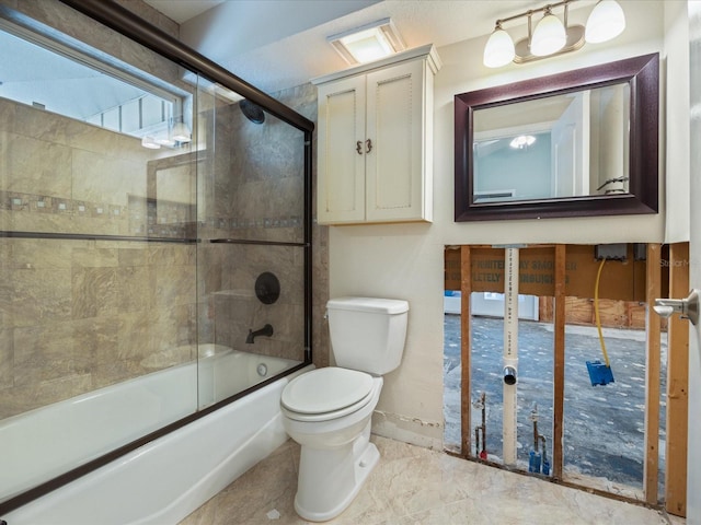 full bath with toilet, bath / shower combo with glass door, and baseboards