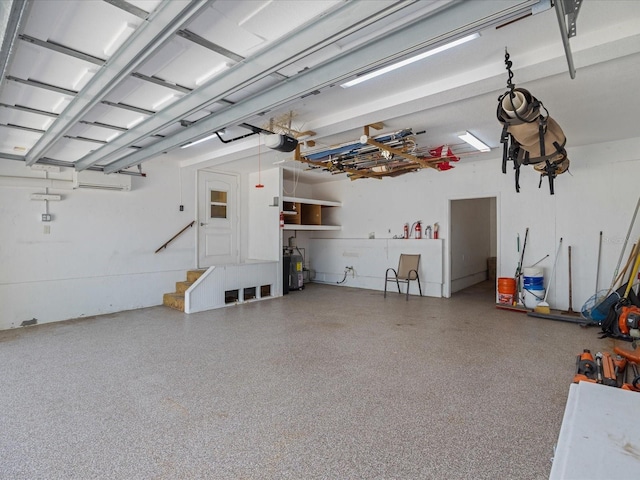 garage with a garage door opener and water heater