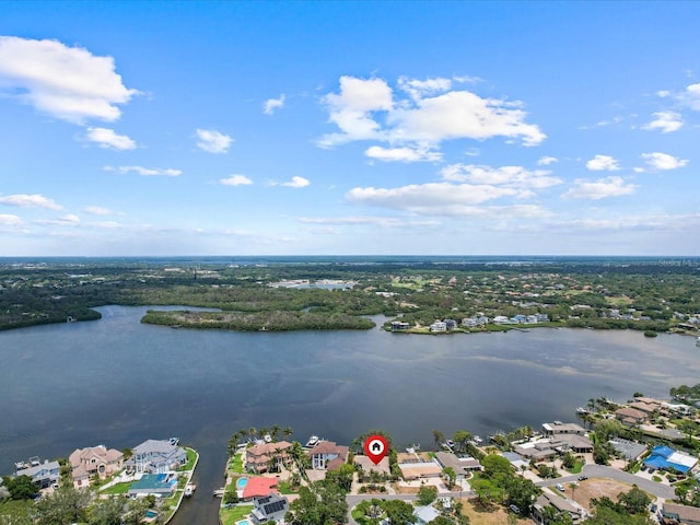 aerial view of residential area featuring a nearby body of water