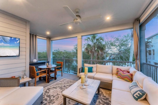 sunroom / solarium featuring expansive windows and recessed lighting