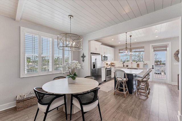 dining room with a chandelier, wooden ceiling, light wood-type flooring, recessed lighting, and baseboards