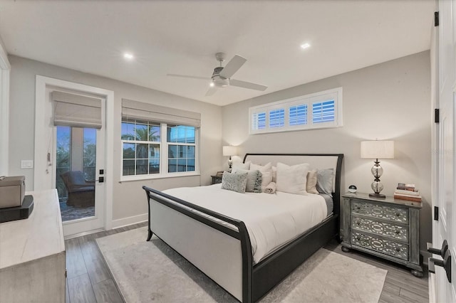 bedroom featuring access to exterior, wood finished floors, recessed lighting, baseboards, and a ceiling fan