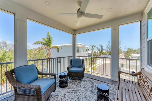 sunroom / solarium with ceiling fan