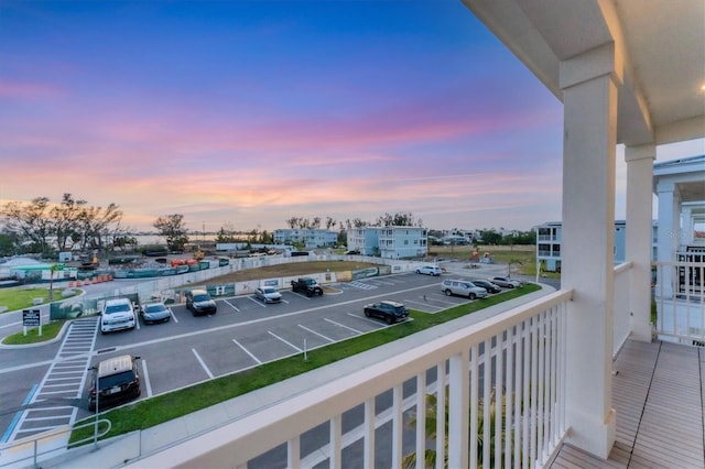 view of balcony at dusk