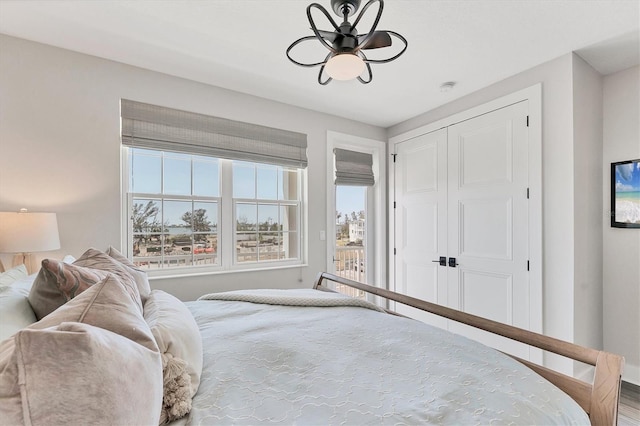 bedroom featuring baseboards and a closet
