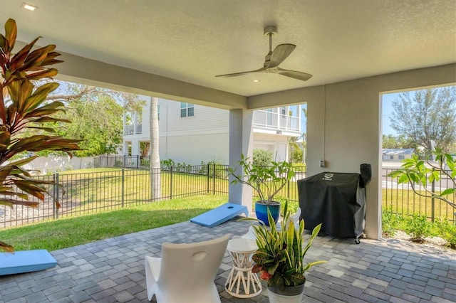 view of patio / terrace featuring grilling area and a ceiling fan