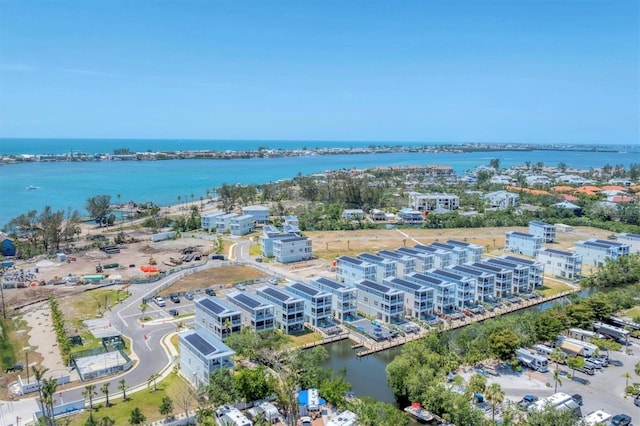 drone / aerial view of a large body of water and apartment complex