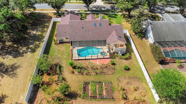 aerial view of property and surrounding area with a pool area