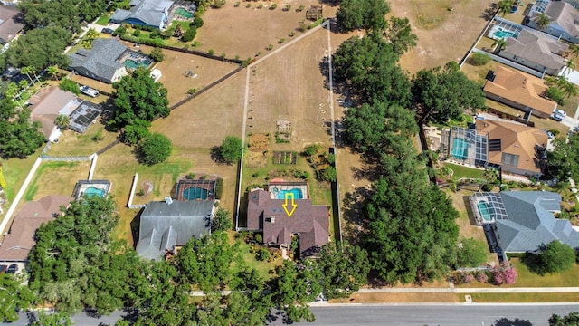 aerial view of property and surrounding area with nearby suburban area