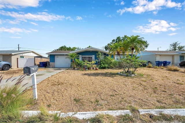 3621 Beacon Square Dr, Holiday, FL 34691 - ranch-style home with concrete driveway, a garage, and fence