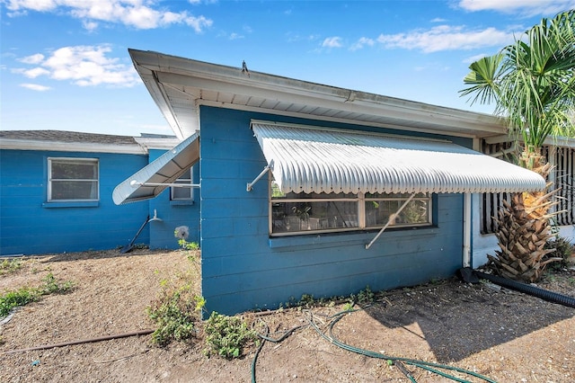 3621 Beacon Square Dr, Holiday, FL 34691 - view of side of property featuring concrete block siding