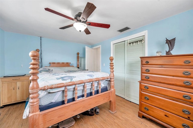 3621 Beacon Square Dr, Holiday, FL 34691 - bedroom with light wood finished floors, a closet, and a ceiling fan