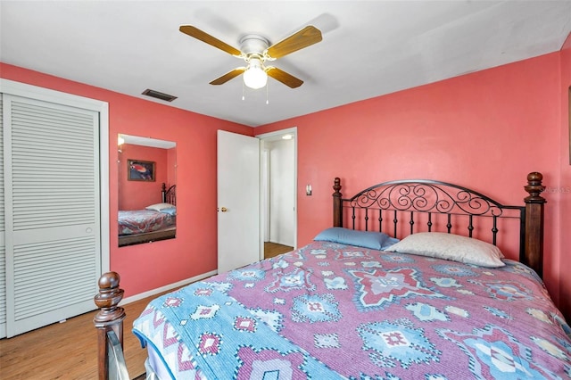 3621 Beacon Square Dr, Holiday, FL 34691 - bedroom with wood finished floors, a closet, and ceiling fan
