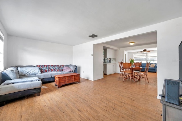 3621 Beacon Square Dr, Holiday, FL 34691 - living area featuring light wood finished floors and ceiling fan