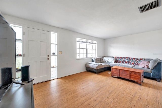 3621 Beacon Square Dr, Holiday, FL 34691 - living room with light wood-style floors and baseboards