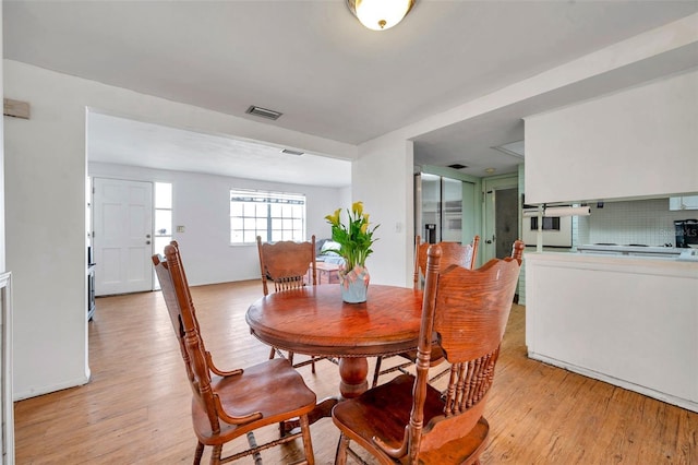 3621 Beacon Square Dr, Holiday, FL 34691 - dining area with light wood-style floors