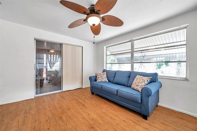 3621 Beacon Square Dr, Holiday, FL 34691 - living area featuring wood finished floors, baseboards, and ceiling fan
