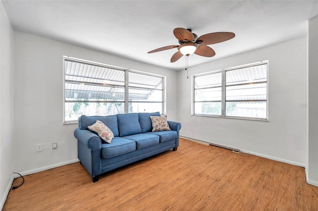 3621 Beacon Square Dr, Holiday, FL 34691 - living area featuring baseboards, ceiling fan, and light wood finished floors