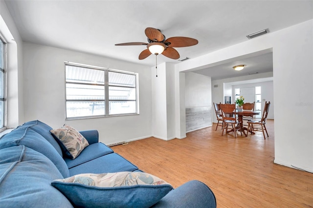 3621 Beacon Square Dr, Holiday, FL 34691 - living area with light wood-style flooring, ceiling fan, and baseboards