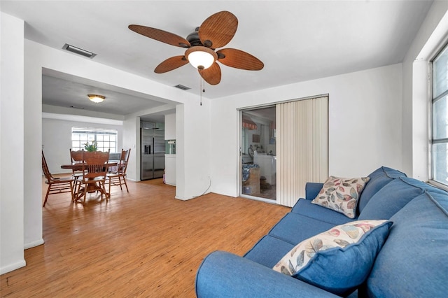 3621 Beacon Square Dr, Holiday, FL 34691 - living room with light wood-style flooring and a ceiling fan