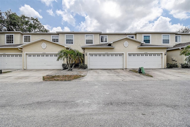 14985 Alan Ct, Largo, FL 33771 - view of property featuring stucco siding and driveway
