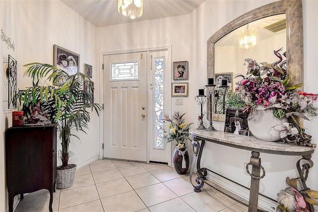 14985 Alan Ct, Largo, FL 33771 - tiled foyer with a chandelier