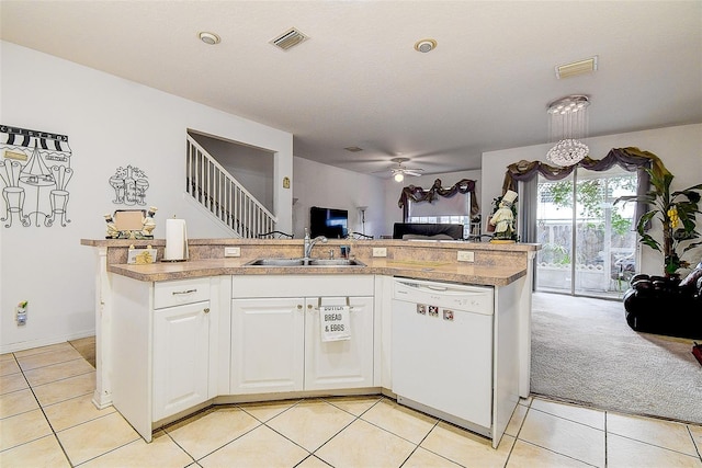 14985 Alan Ct, Largo, FL 33771 - kitchen with white dishwasher, a sink, open floor plan, ceiling fan, and light tile patterned floors