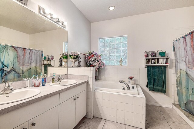 14985 Alan Ct, Largo, FL 33771 - bathroom featuring tile patterned flooring, a shower with shower curtain, a garden tub, double vanity, and recessed lighting