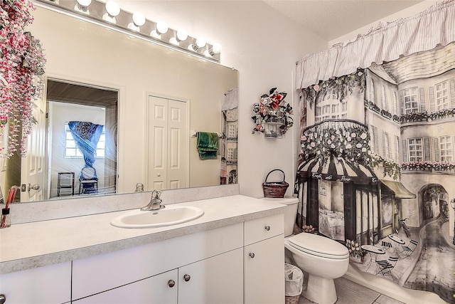 14985 Alan Ct, Largo, FL 33771 - bathroom featuring tile patterned floors, toilet, and vanity